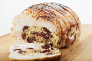 Roasted turkey breast stuffed with stuffing and dried cherries, then rolled, tied and roasted.