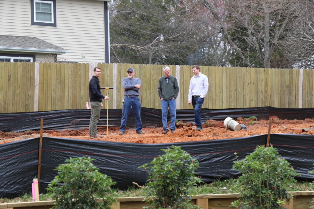 Jacob Allman meets with builders.