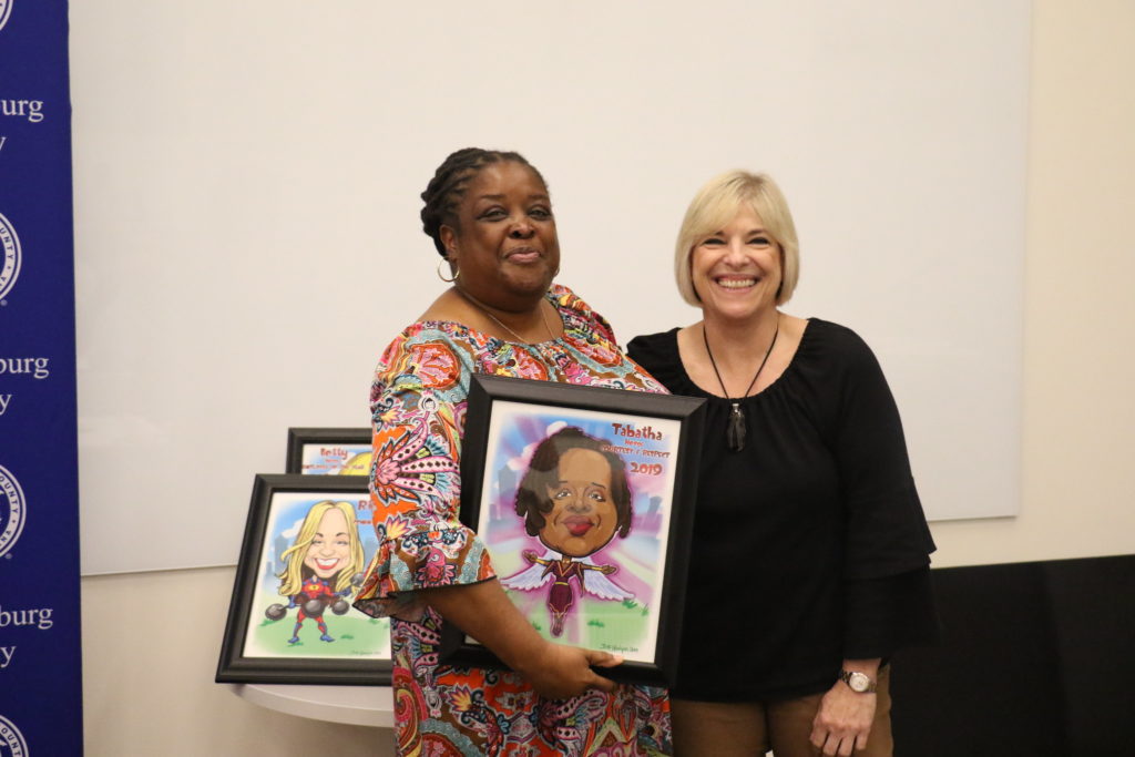 Courtesy and Respect winner Tabatha Howard poses with County Manager Dena R. Diorio while accepting her Customer Service Hero Award.