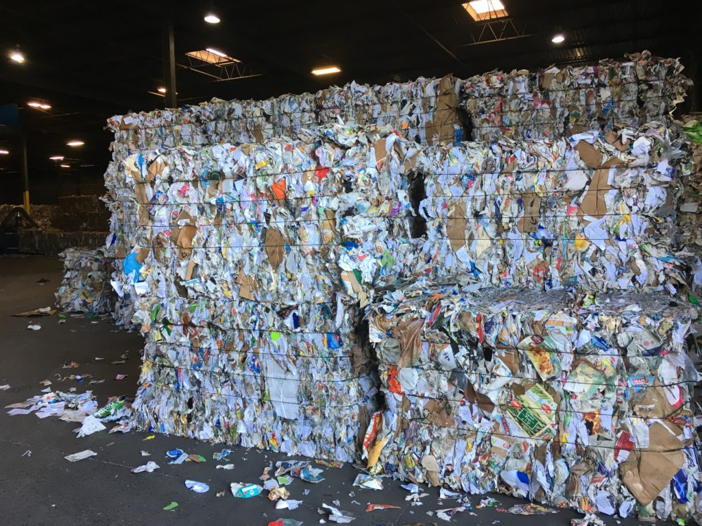 Stacks of recycled materials packed together.