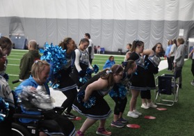 group of people having fun cheerleading on a sideline 