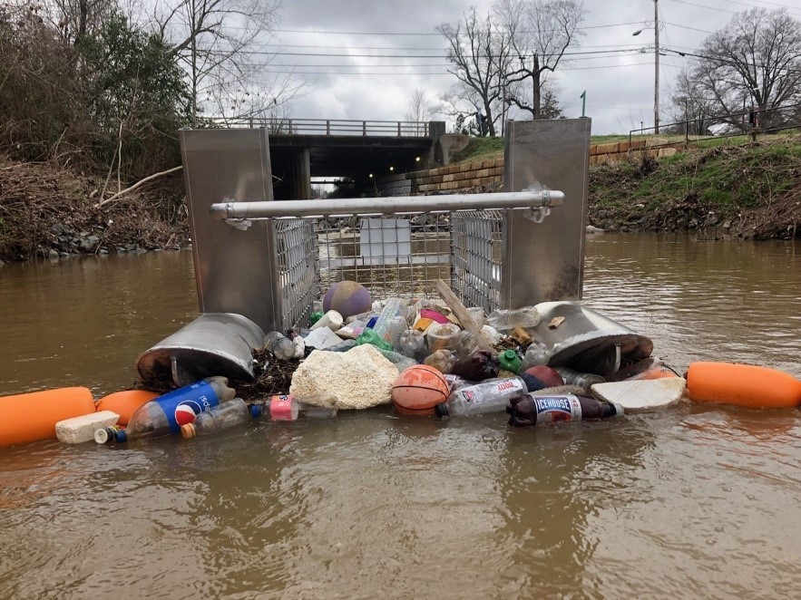 a litter gitter filled with trash and recyclable materials