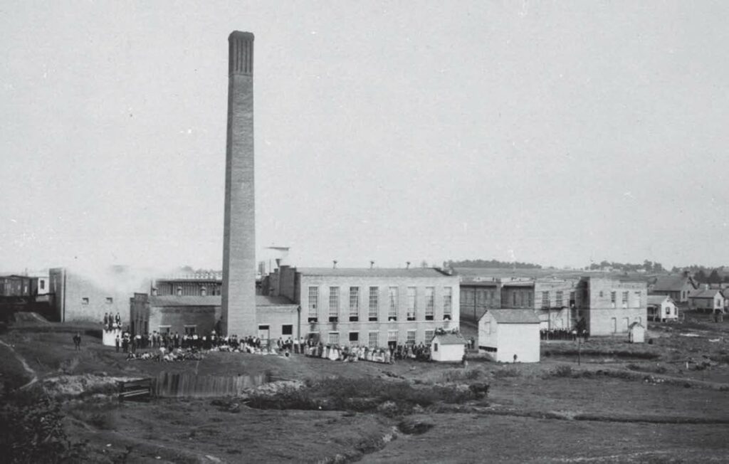 Black and white photo of Highland Mill #1 which is now known as Optimist Hall. 